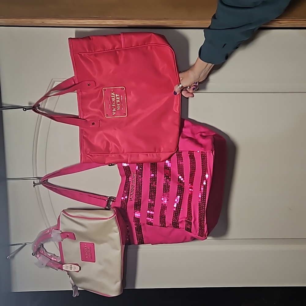 Three Victoria's Secret bags,- one new with tags.